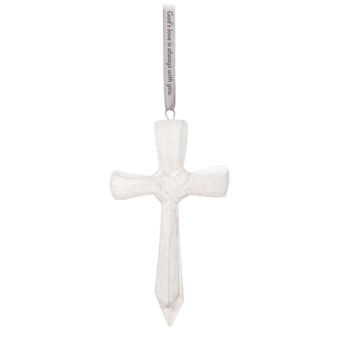 White cross-shaped ornament with  text on a white background