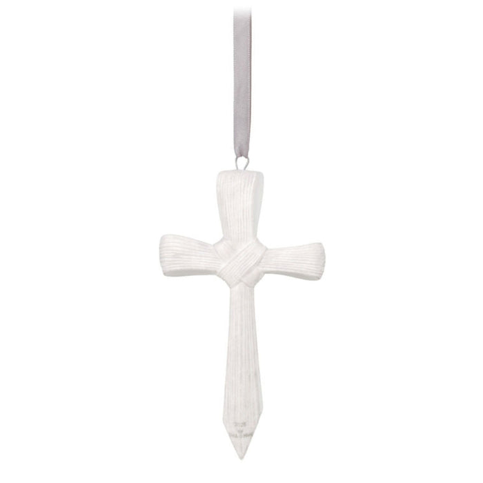 White cross ornament on a white background