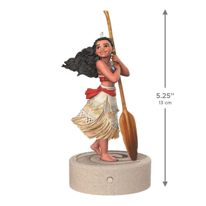 Front view of 2026 Hallmark Moana musical ornament showing 5.25 inch height and spiral base