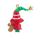 Christmas ornament of an elf climbing a gingerbread man with a gold star on a white background