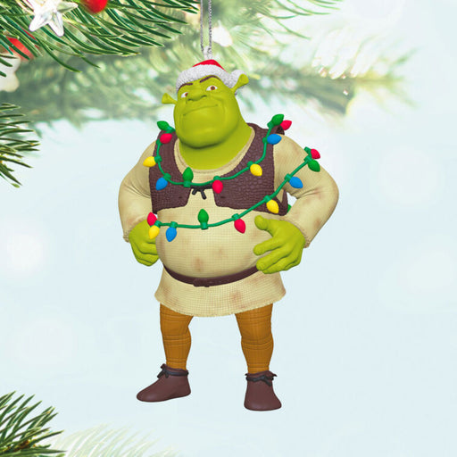 Shrek ornament with Christmas lights on his body, hanging form a tree