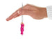 Hand holding a Mini Hallmark Keepsake Barbie  ornaments with the pink dressed Barbie on a white background