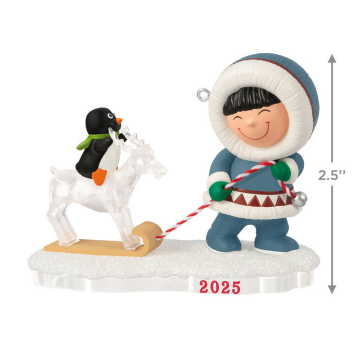 Christmas ornament with a child pulling a penguin on a ice reindeer on a sleigh, on a white background with product dimensions 