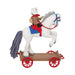 Backside of the Christmas ornament of  a horse on a  cart, featuring a bear rider playing a guitar on a white background. 