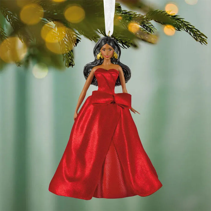 Front View: 2026 Hallmark Keepsake Latina Holiday Barbie Christmas Ornament wearing an elegant festive gown hanging on a festive tree  