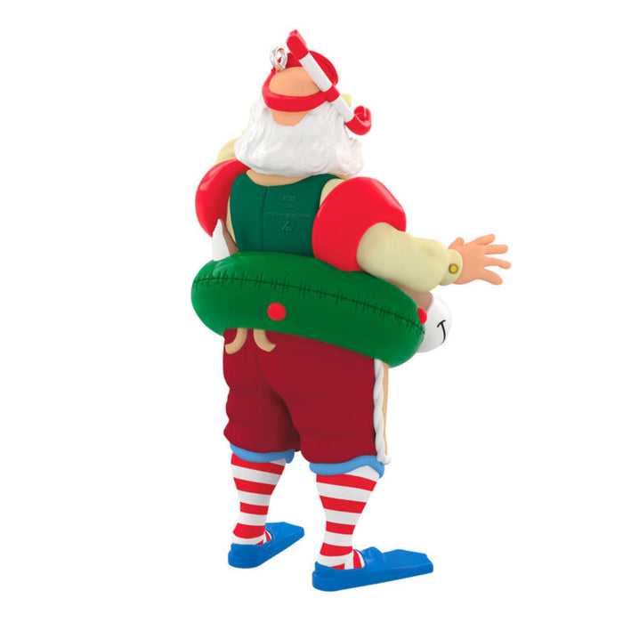 Backside of the Decorative Holiday  ornament of a Santa Claus figure with a reindeer floatie, holding a boat labeled '2025'. on a white background