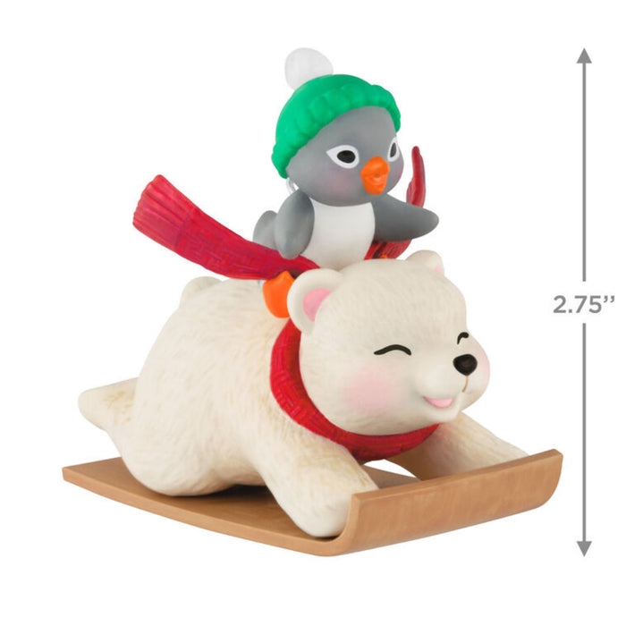 Christmas ornament with a polar bear and penguin on a sleigh on a white background  with product dimensions 