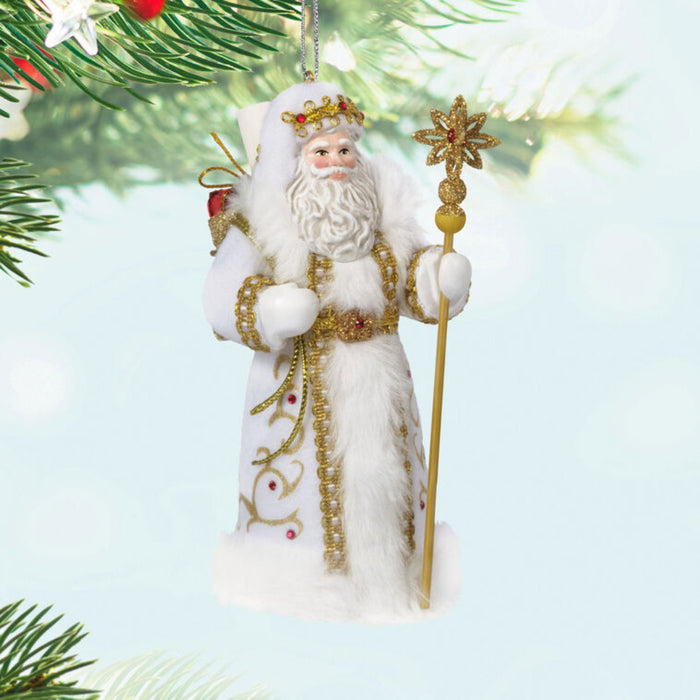 Caucasian Father Christmas ornament  holding a golden staff hanging on a tree
