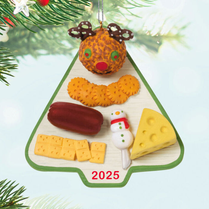 Christmas Tree shaped charcuterie board "2025" Ornament hanging from a tree
