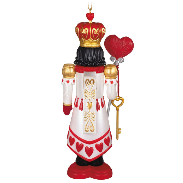 Backside of the Decorative nutcracker ornament with a crown, heart-shaped key, and heart scepter on  a white background .