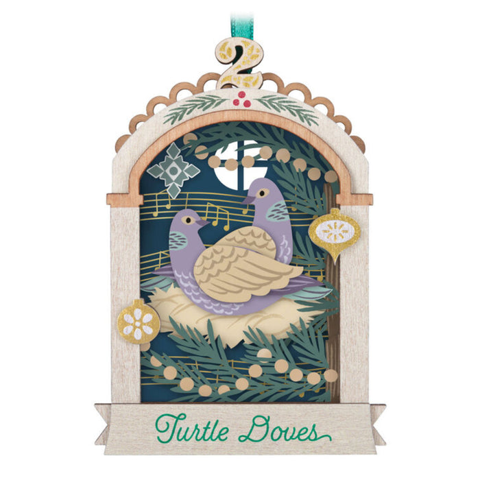 Decorative Christmas ornament with a turtle dove and musical notes on a white background 