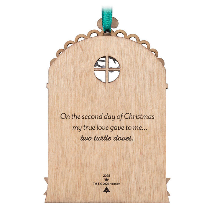 Backside of the Decorative Christmas ornament with a turtle dove and musical notes on white background
