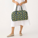 Person holding Vera Bradley Miramar Weekender in Daffodils – quilted cotton floral weekender bag with spacious interior and zipper closure.