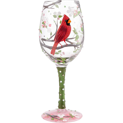 Wine glass with a red cardinal bird design on a white background