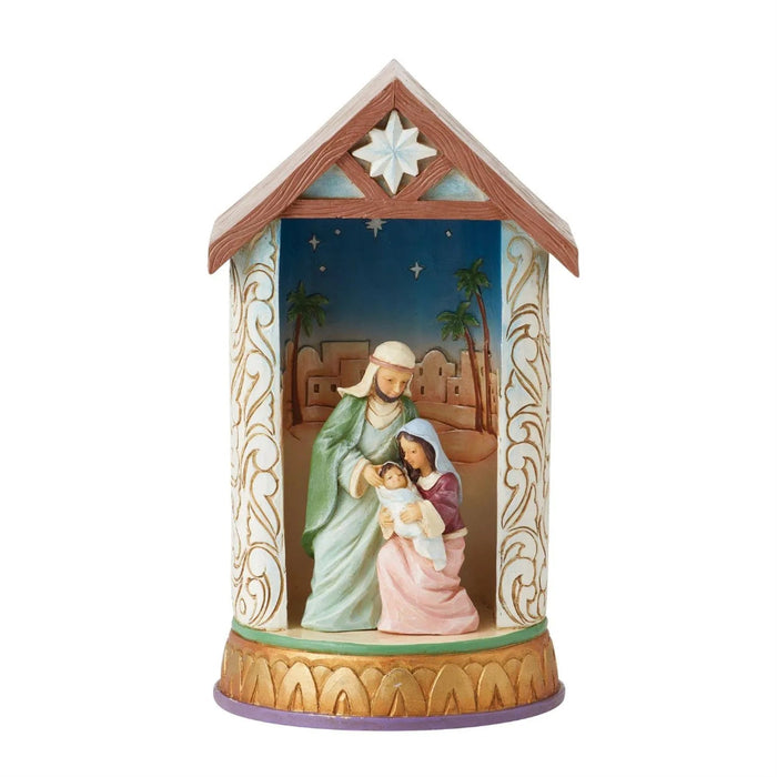 Decorative Jim Shore Figurine nativity scene in a house-shaped container with a star on top light off  .