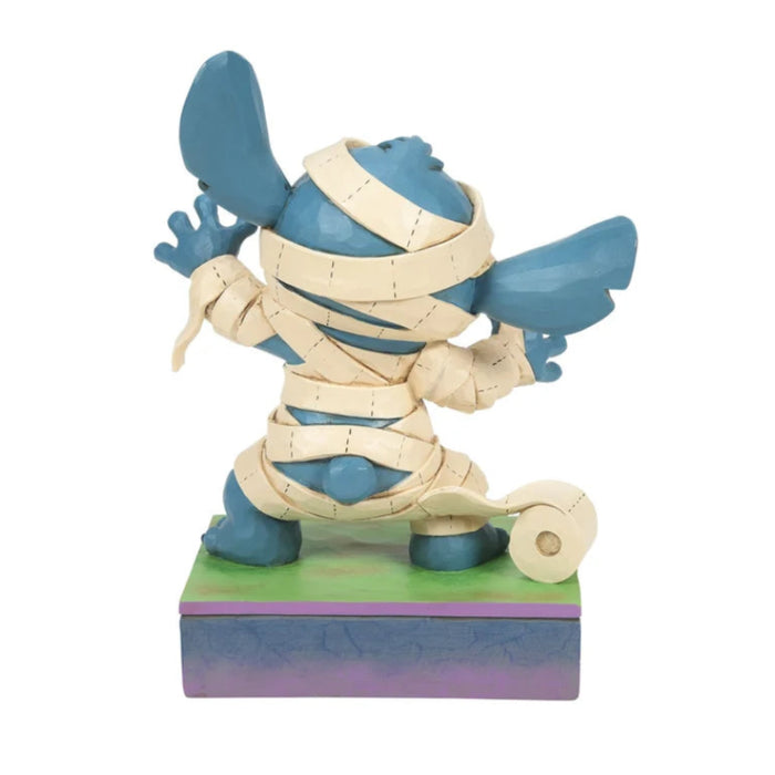 Mummy Stitch figurine featuring Disney's Stitch dressed in a playful mummy costume for Halloween décor.