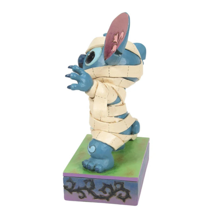 Mummy Stitch figurine featuring Disney's Stitch dressed in a playful mummy costume for Halloween décor.