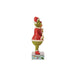 Left side of Jim Shore Figurine of Grinch in a red sweater and Santa hat holding Cindy with a sign, on a white background.