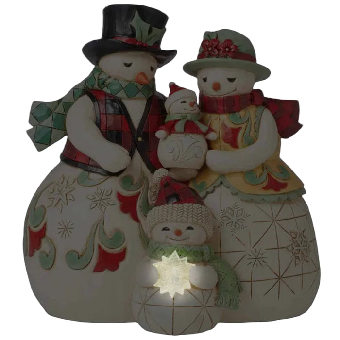  Jim Shore Decorative snowman family figurine with the child snowman holding a light (AAA batteries)  at the base on a white background