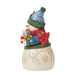 Right side view of Jim Shore Decorative snowman figurine with a blue coat, green hat, and holding presents  on a white background.
