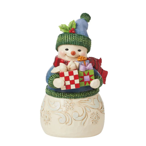 Jim Shore Decorative snowman figurine holding gifts on a white background