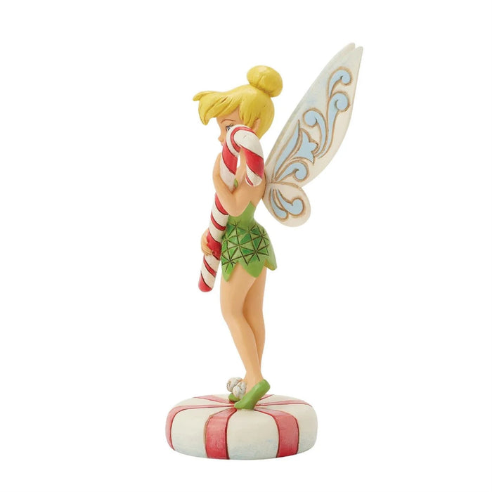 Right size view of  Jim Shore Figurine of Tinkerbell the fairy holding a candy cane on a white background
