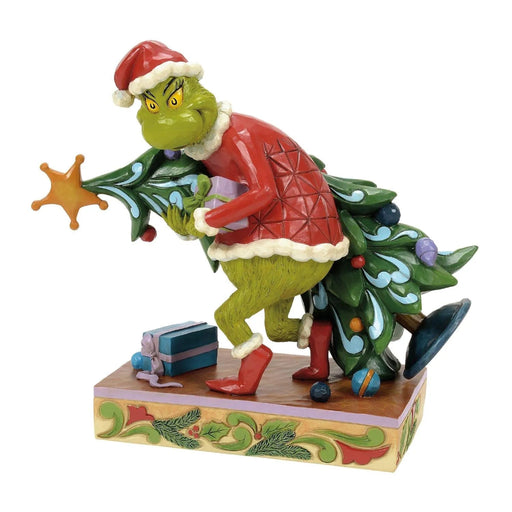 Animated  Grinch character  Jim Shore figurine with a Christmas tree and gift on a white background