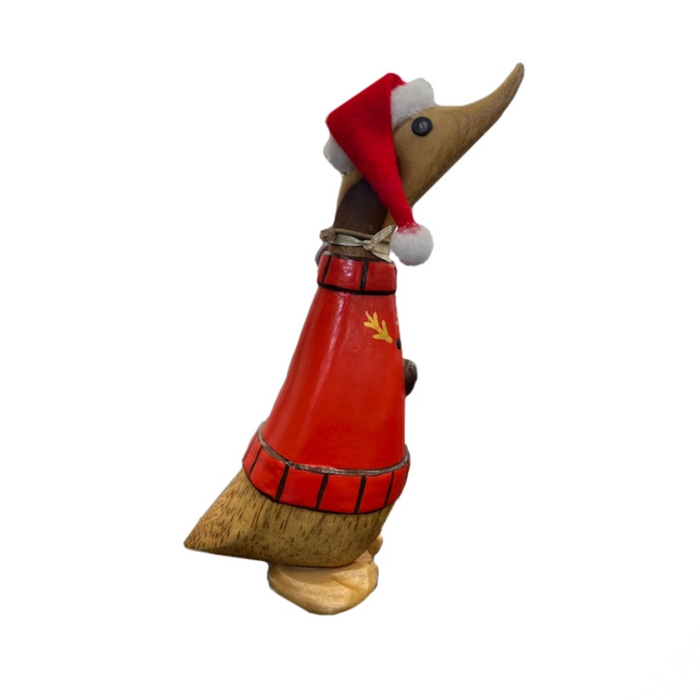 Wooden duck figurine wearing a red outfit and Santa hat on a white background