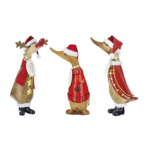 Three Christmas-themed duck figurines wearing Santa hats and festive outfits on a white background. Included  one at random