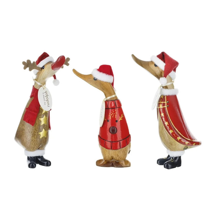 Three Christmas-themed duck figurines wearing Santa hats and festive outfits on a white background. Included  one at random
