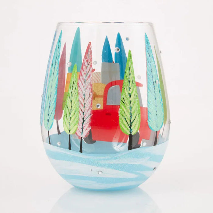Decorative glass with a colorful tree and house design on a white background