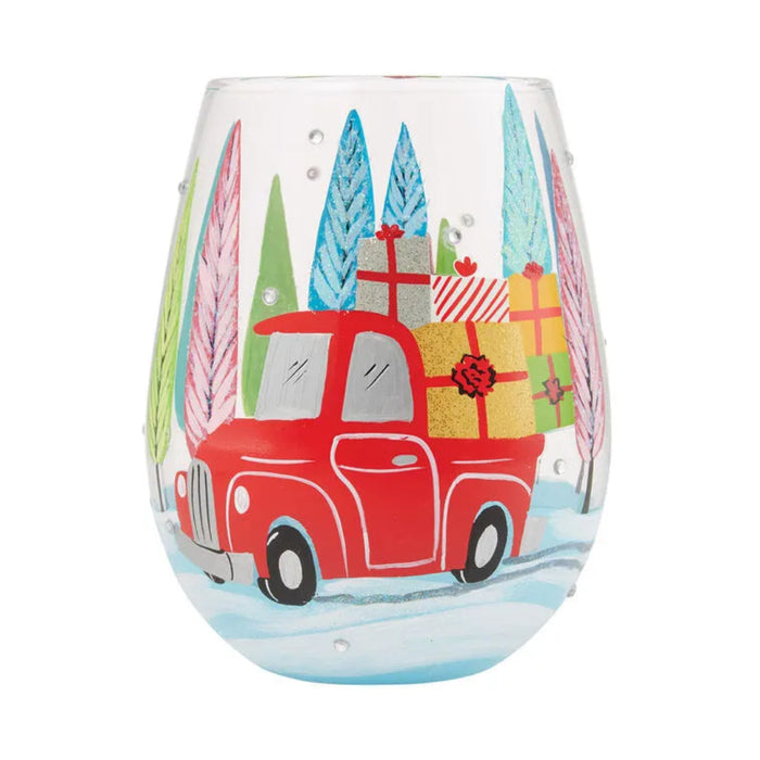 Stemless wine glass with a red truck and Christmas presents design on a white background