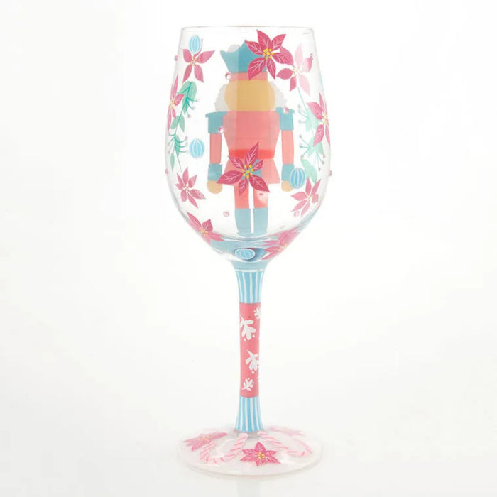 Decorative  Christmas themed wine glass with a colorful design on a white background