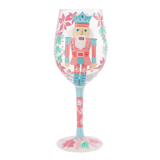Decorative wine glass with a nutcracker design on a white background