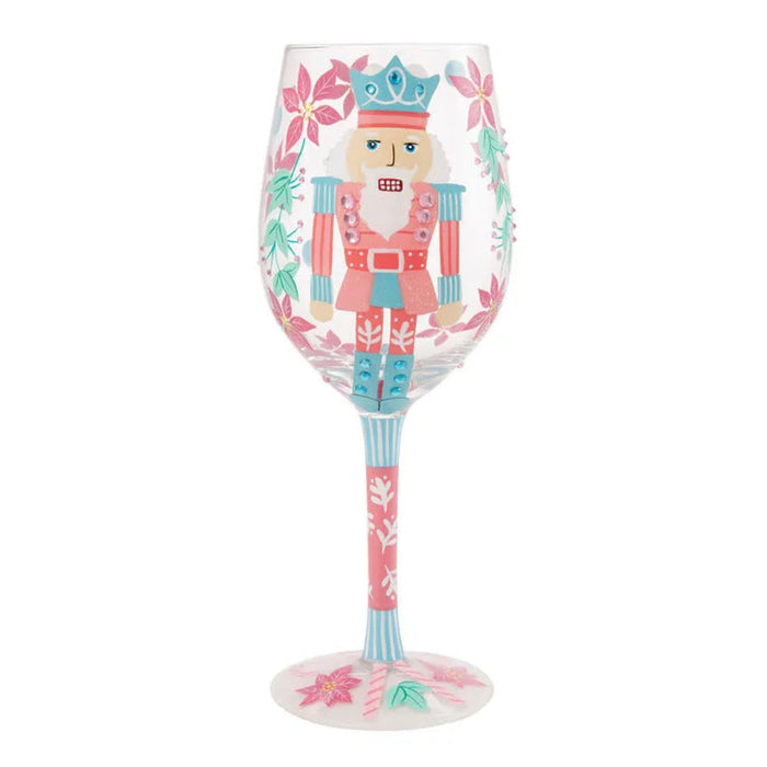 Decorative wine glass with a nutcracker design on a white background