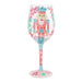 Decorative wine glass with a nutcracker design on a white background