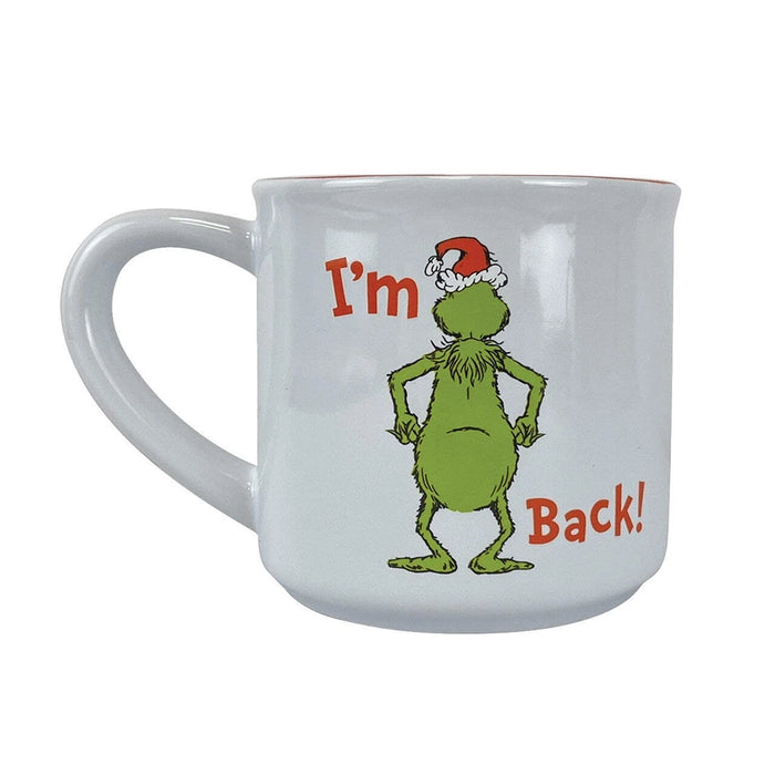 White mug with a cartoon character wearing a Santa hat and text 'I'm Back!' on a white background