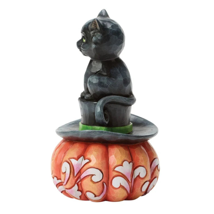 Black cat perched on a classic top hat in a whimsical Halloween figurine designed for spooky seasonal décor.