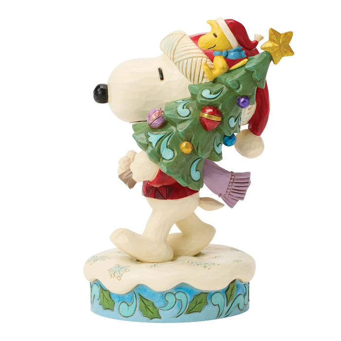 This Jim Shore Snoopy and Woodstock with Tree Figurine brings the beloved Peanuts characters to life with Jim Shore’s signature folk-art styling.