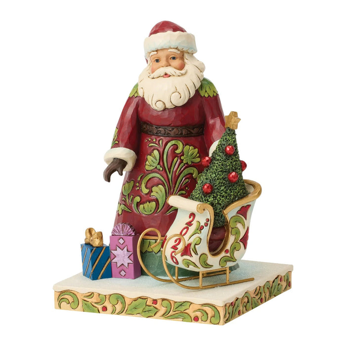 This Jim Shore 2026 Dated Santa Figurine features Jim Shore’s signature folk-art style, with intricate patterns, cheerful colors, and handcrafted details that create a warm and festive look.