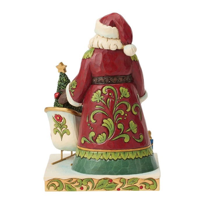 This Jim Shore 2026 Dated Santa Figurine features Jim Shore’s signature folk-art style, with intricate patterns, cheerful colors, and handcrafted details that create a warm and festive look.