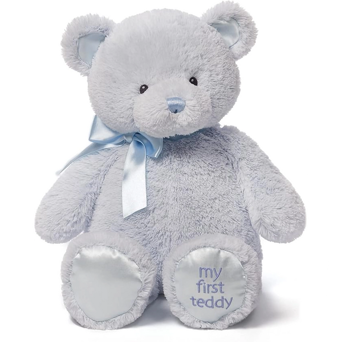 Baby Blue  teddy bear with a blue bow and 'my first teddy' text on a white background
