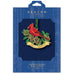 Beacon Design Christmas ornament packaging with a red cardinal and greenery design.
