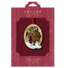 Beacon Design Christmas ornament packaging with a gold reindeer design on a red background.