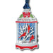 Decorative Christmas ornament with cardinals in a cage on a white background