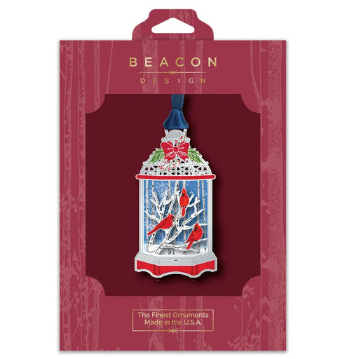 Beacon Design Christmas ornament packaging with a red and white lantern design.
