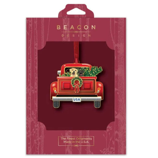 Red truck ornament with a dog and wreath on a Beacon Design packaging