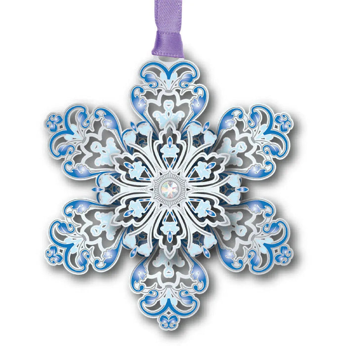 Decorative snowflake ornament with blue and silver design on a white background