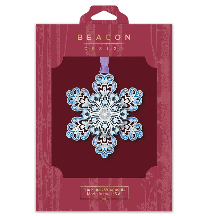 Decorative snowflake ornament in Beacon Design packaging on a white background
