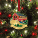 A red and white Christmas ornament with a bridge illustration and a customizable sign that reads "custom name."